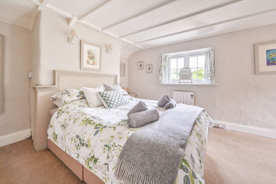 This is an example of a country bedroom in Cornwall.