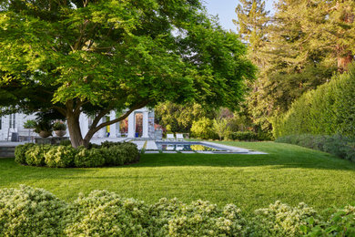 Photo of a traditional full sun backyard stone formal garden in San Francisco.