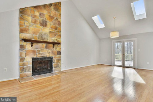 Help With Orange Stone Floor To Ceiling Fireplace