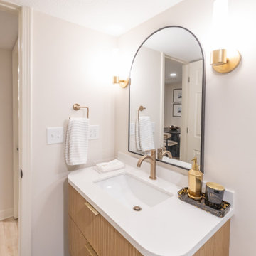Warm & Inviting Basement Retreat with Custom Bar + Entertainment Center