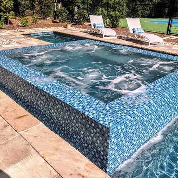 Gorgeous Glass Tile 360 Spillover Spa and lap pool