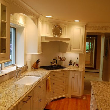 Matching arched valence and granite. Angled stove position.