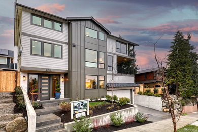 Inspiration for a large modern three-storey house exterior in Seattle.