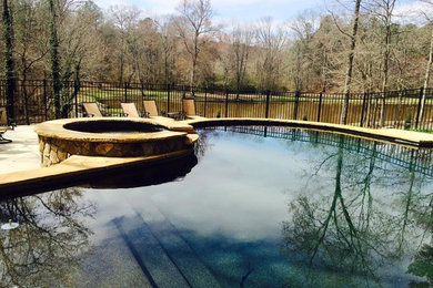 Inspiration for a mid-sized craftsman backyard concrete paver and kidney-shaped hot tub remodel in Atlanta