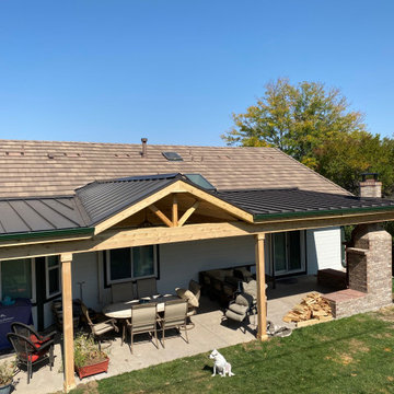 Patio roof cover with brick fireplace.