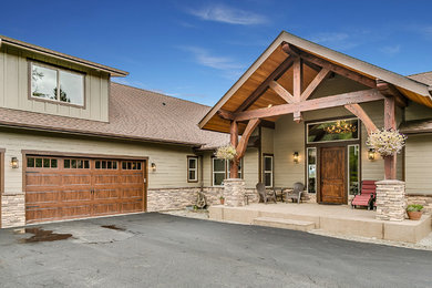 Inspiration for a large craftsman brown two-story wood exterior home remodel in Seattle with a shingle roof