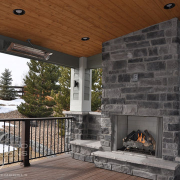 Castle Rock Covered Deck with Fireplace and Iron Railing