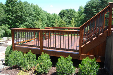 Mid-sized mountain style backyard patio photo in Philadelphia with decking and no cover