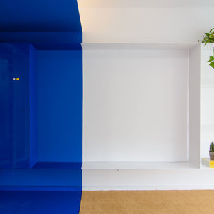 Inspiration for a small modern study in Other with blue walls, carpet and blue floors.
