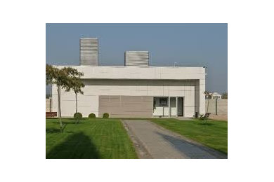 Inspiration for a small contemporary one-story exterior home remodel in Other