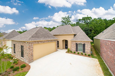 Inspiration for a timeless one-story exterior home remodel in New Orleans