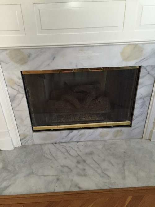 Glue bled through marble on fireplace