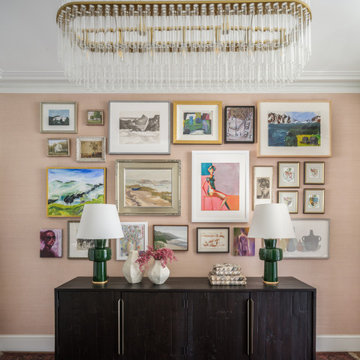 Entryway with Gallery Wall, Dark Wood Console, and Glass-and-Brass Chandelier
