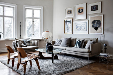 Design ideas for a large scandinavian living room in Gothenburg with dark hardwood floors.
