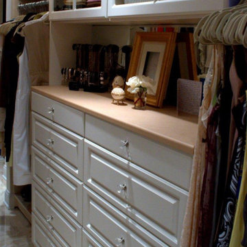 Beautiful Walk-in with Raised Panel Drawers and Glass Knobs