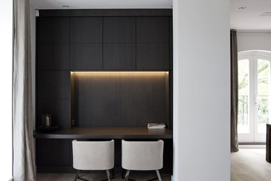Home office - mid-sized contemporary home office idea in Amsterdam with white walls