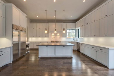 Elegant medium tone wood floor kitchen photo in Houston