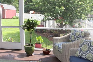 Mid-sized elegant screened-in back porch photo in Other with decking and a roof extension