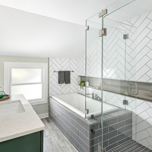 This is an example of a small contemporary master bathroom in Milwaukee with shaker cabinets, green cabinets, a drop-in tub, a corner shower, a two-piece toilet, white tile, porcelain tile, beige walls, vinyl floors, an undermount sink, engineered quartz benchtops, brown floor, a hinged shower door, white benchtops, a shower seat, a single vanity and a built-in vanity.