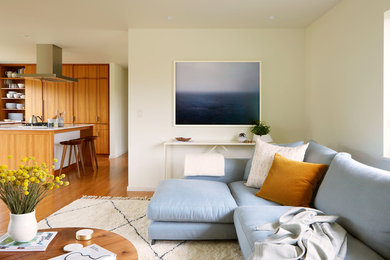 Living room - small 1960s open concept medium tone wood floor and brown floor living room idea in Seattle with white walls, a standard fireplace, a brick fireplace and no tv