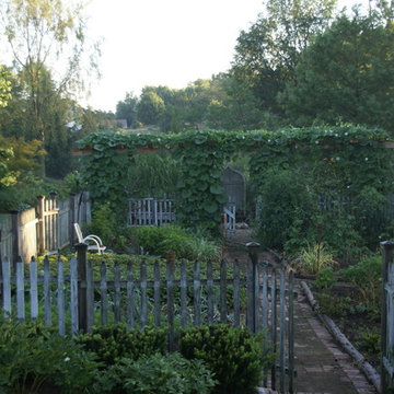 Informal edible garden leads to gravel firepit