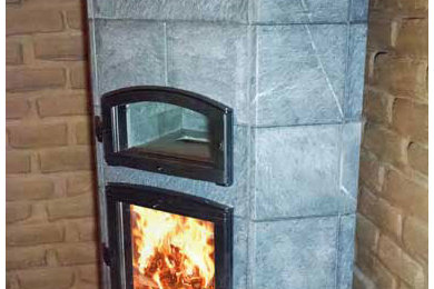 Living room library - small traditional enclosed ceramic tile living room library idea in Denver with gray walls, a standard fireplace, a stone fireplace and no tv