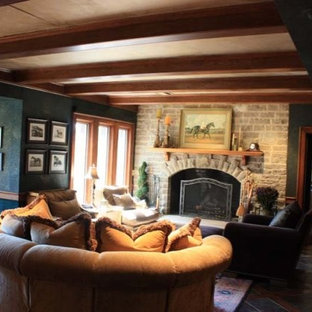 Medium sized classic enclosed home cinema in Other with blue walls, terracotta flooring and a projector screen.