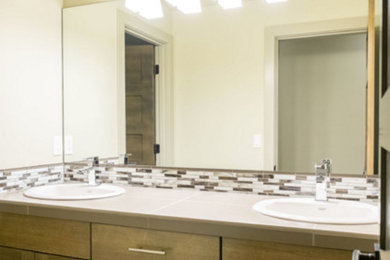 Mid-sized transitional kids' bathroom photo in Portland with recessed-panel cabinets and medium tone wood cabinets