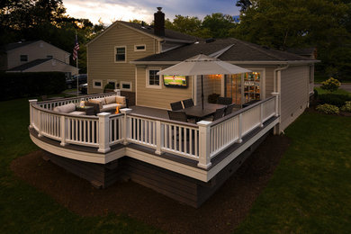 Inspiration for a large transitional backyard deck in Other with no cover and a fire feature.