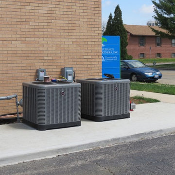 Ward Plumbing Installing Air Conditioners On The Roof of Insurance Partners, Inc