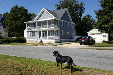 Inspiration for a small timeless gray two-story vinyl exterior home remodel in Baltimore with a shingle roof