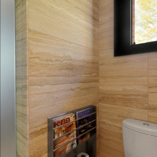 Inspiration for a mid-sized country 3/4 bathroom in Burlington with stone tile, a one-piece toilet and beige walls.