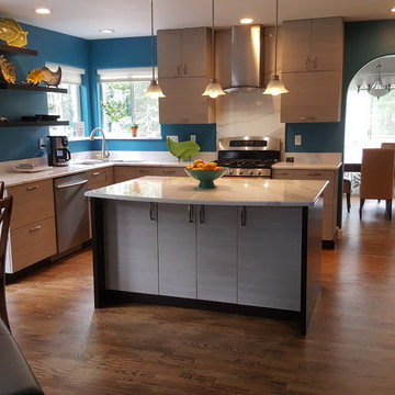 This is a two tone updated kitchen with efficient use of space & feature points