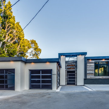 Street Elevation at Dusk with Frosted Glass Garage Doors