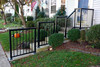 Small minimalist concrete straight metal railing staircase photo in Baltimore with concrete risers