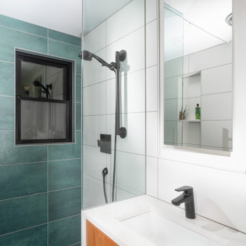 Owner's Bathroom Glass & Waterfall Countertop