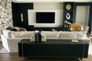 Inspiration for a huge transitional open concept medium tone wood floor and wallpaper living room remodel in Tampa with a wall-mounted tv