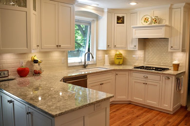 Inspiration for a mid-sized timeless u-shaped eat-in kitchen remodel in Other with a peninsula