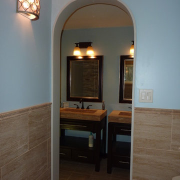 Elegant Contemporary vanity area with separate toilet/shower area