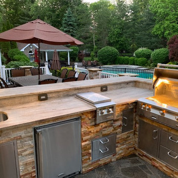 Traditional Outdoor Kitchen completing an Amazing Backyard