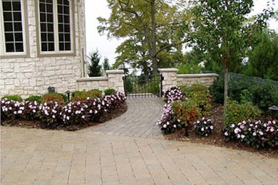Inspiration for a large shade side yard brick garden path in Cleveland.