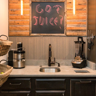 Huge farmhouse kitchen pantry remodeling - Huge farmhouse l-shaped dark wood floor kitchen pantry photo in Nashville with an undermount sink, recessed-panel cabinets, black cabinets, granite countertops, gray backsplash, ceramic backsplash, stainless steel appliances and no island