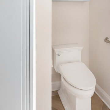 Universal Design in Classic Marble Primary Bathroom
