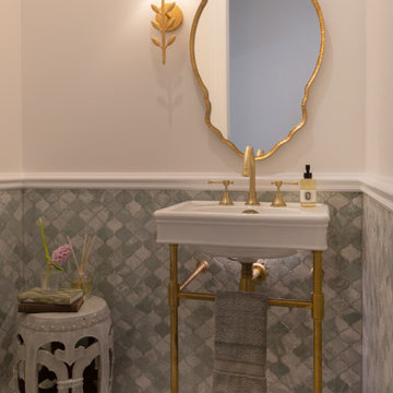 Turkish QueenslanderThis elegant powder room combines handcrafted green marble f