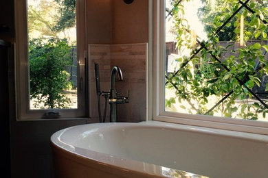 Freestanding bathtub - large transitional master beige tile and ceramic tile travertine floor and multicolored floor freestanding bathtub idea in San Luis Obispo with beige walls