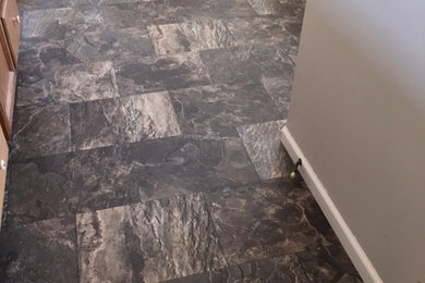 Inspiration for a small timeless master slate floor bathroom remodel in Minneapolis with flat-panel cabinets, medium tone wood cabinets, a two-piece toilet and white walls