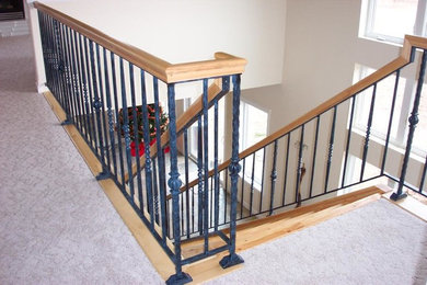 Staircase - mid-sized traditional wooden straight metal railing staircase idea in San Diego