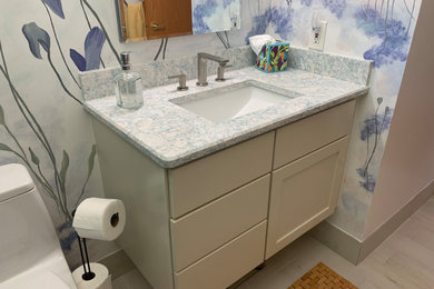 Example of an eclectic powder room design in Detroit