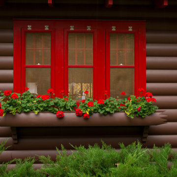 Rustic Storybook Style Quarter Log Siding Lodge