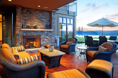 Mid-sized tuscan backyard concrete patio photo in Seattle with a fire pit and a roof extension